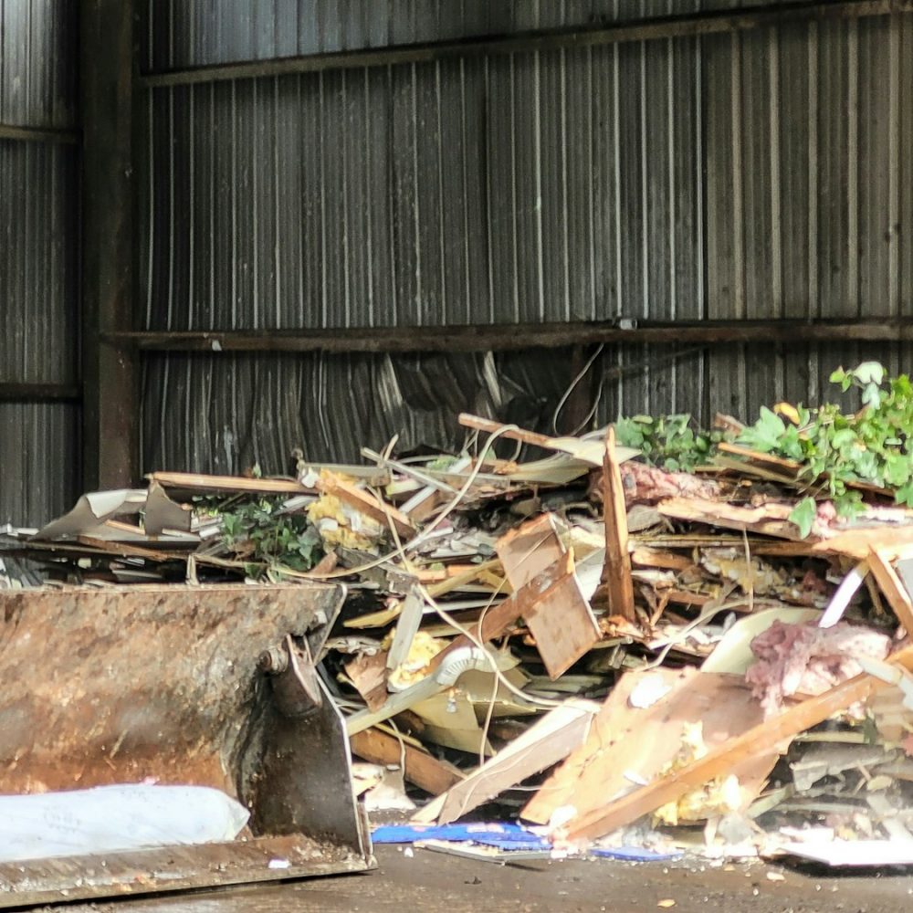 Bulldozer at trash disposal site ready to sort trash for removal to another site.